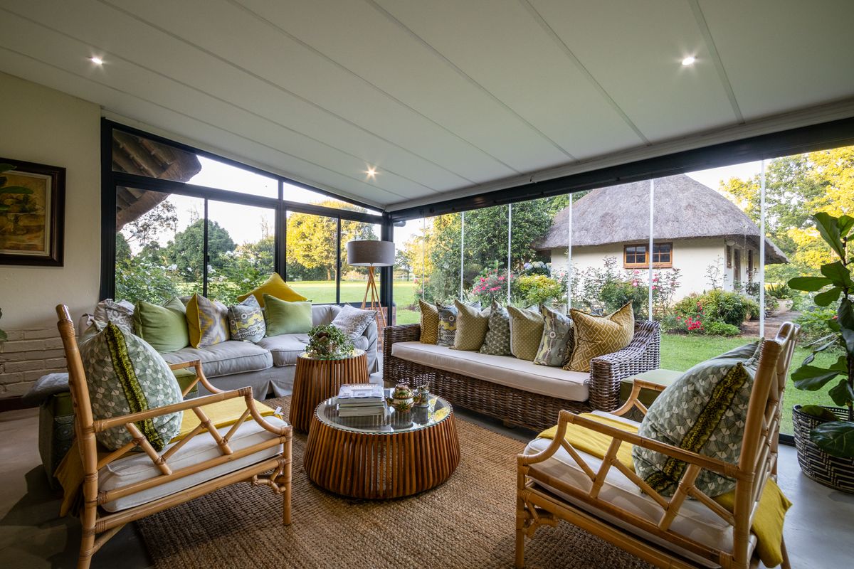 Furnished covered veranda looking out onto a garden